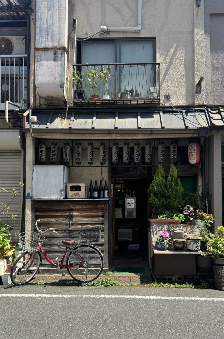 An old shop with a red bike in Yanaka